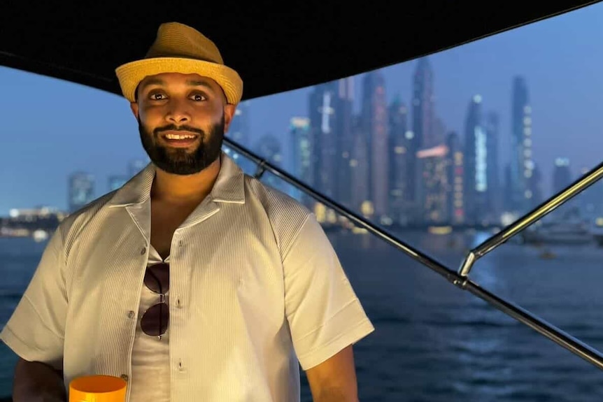 Bharat on a boat at nighttime