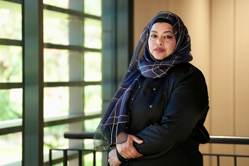 A professional with a sombre expression.