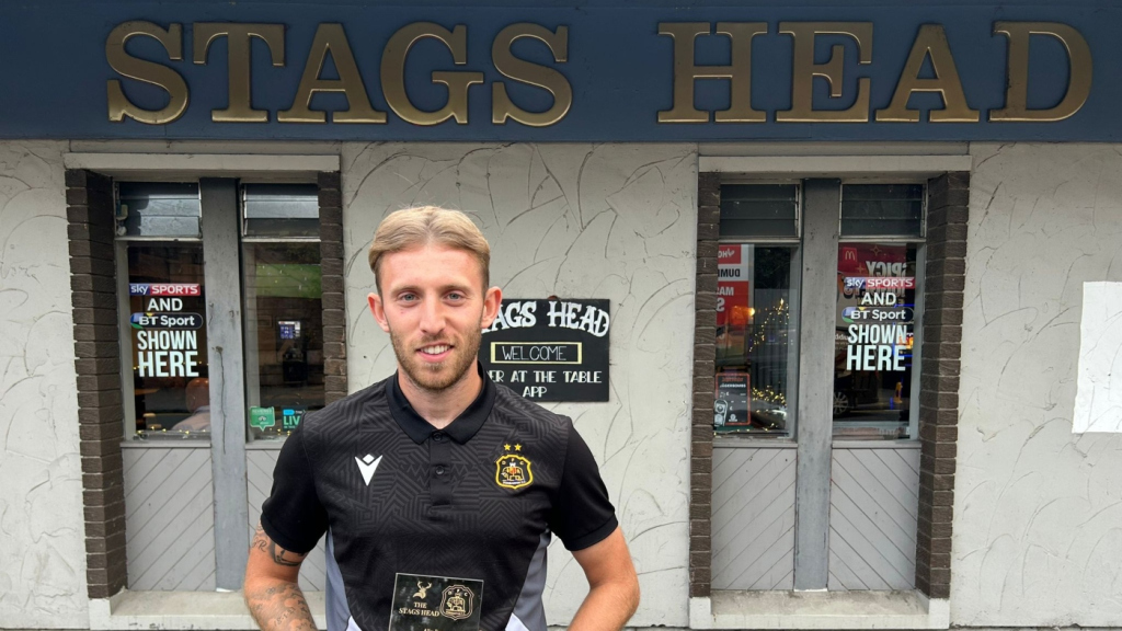 Dumbarton striker Ally Roy with the Stags Head Player of the Month award for July 2025