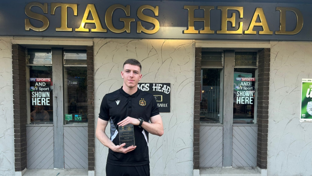 Kai Kirkpatrick with his August Player of the Month trophy outside the Stags Head