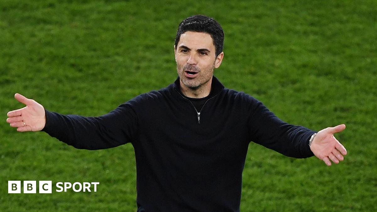 Mikel Arteta with his arms outstretched
