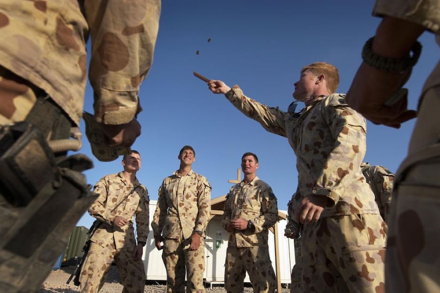 Australians soldiers playing two-up