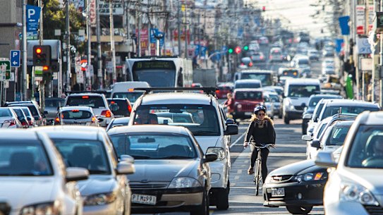 A cyclist making their way along Sydney Road, one of the most dangerous routes in the city.