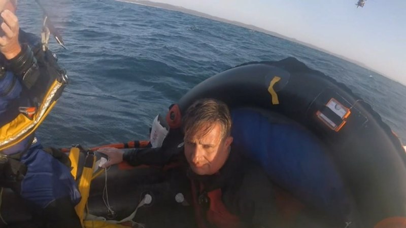 Divers saved after nearly 24 hours in rough waters