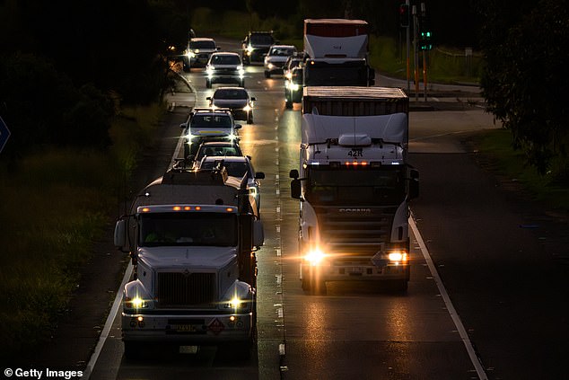 SYDNEY, AUSTRALIA - APRIL 02: Trucks drive through the Foreshore Road in Port Botany on April 02, 2026 in Sydney, Australia. Australian Prime Minister Anthony Albanese urged citizens to back the temporary reduction in fuel excise and a cut to truck road use charges, saying both measures would deliver immediate relief at the bowser and in freight costs, and called on Australians to hold their local representatives accountable for the cost-of-living crisis. (Photo by George Chan/Getty Images)