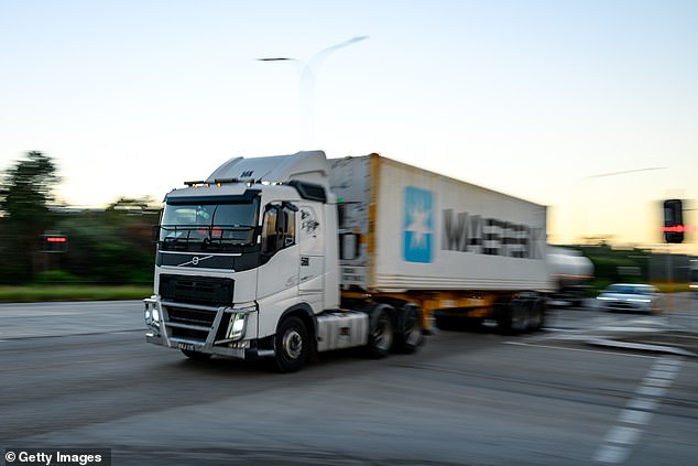 SYDNEY, AUSTRALIA - APRIL 02: A truck drives through the Foreshore Road in Port Botany on April 02, 2026 in Sydney, Australia. Australian Prime Minister Anthony Albanese urged citizens to back the temporary reduction in fuel excise and a cut to truck road use charges, saying both measures would deliver immediate relief at the bowser and in freight costs, and called on Australians to hold their local representatives accountable for the cost-of-living crisis. (Photo by George Chan/Getty Images)