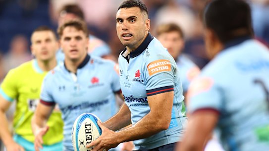 Jack Debreczeni on the attack for the Waratahs against the Blues.