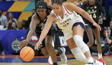 UConn’s Sarah Strong (21) runs down a loose ball before getting fouled by South Carolina's Raven Johnson (25) during their Final Four match up at the Mortgage Matchup Center in Phoenix, Arizona Friday, April 3, 2026.