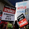 Striking Writers Guild members picket alongside SAG-AFTRA members outside Netflix studios in September of 2023.