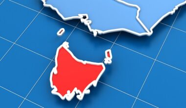 An outline map showing Victoria and the Tasmanian landmasses, with Victoria in light blue and Tasmania in red
