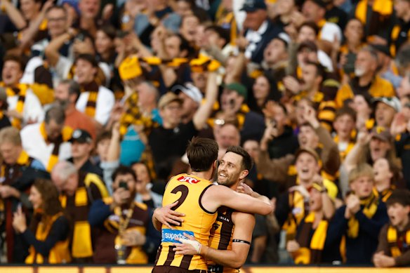 Lewis and Jack Gunston embrace after their side’s thrilling win.