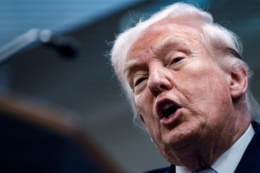 A close up of Donald Trump mid speech.