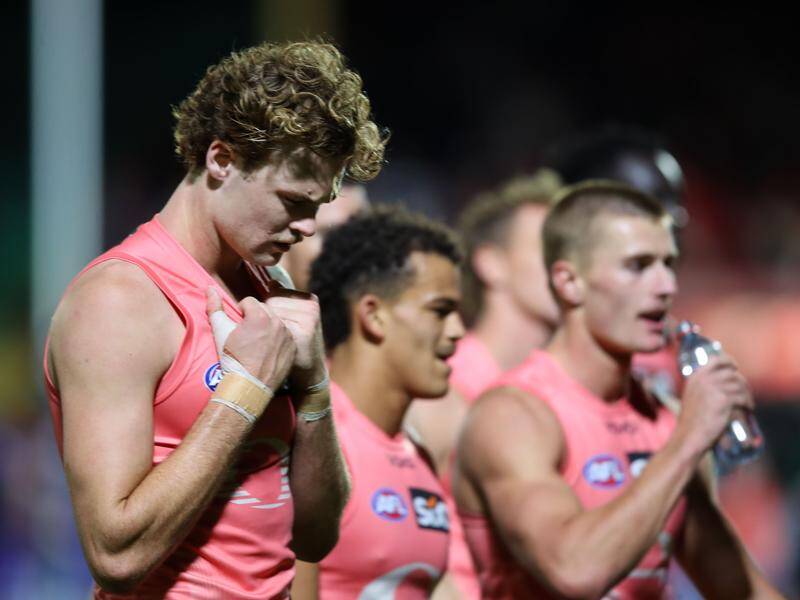 The Suns players had plenty to reflect on after their loss to the Sydney Swans in Adelaide.  Photo: Matt Turner/AAP PHOTOS