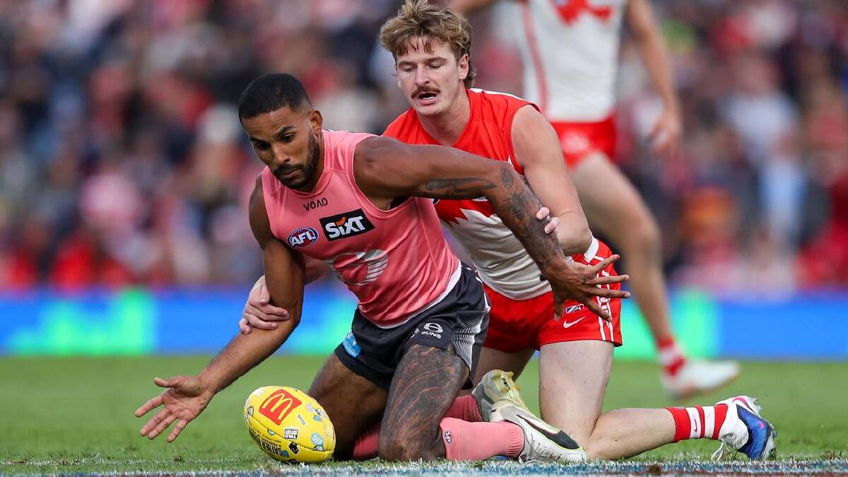 Gold Coast midfielder Touk Miller was put under plenty of pressure by Sydney's Riley Bice. (Matt Turner/AAP PHOTOS)