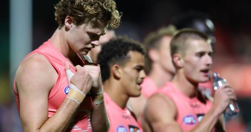 The Suns players had plenty to reflect on after their loss to the Sydney Swans in Adelaide.  Photo: Matt Turner/AAP PHOTOS