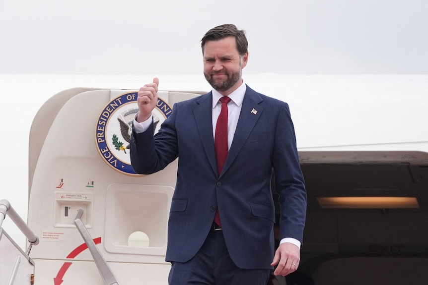U.S. Vice President JD Vance disembarks from Air Force Two.