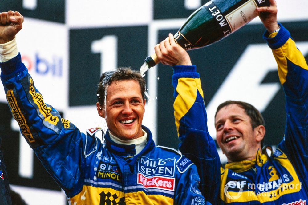Michael Schumacher, 1st position, and Martin Brundle, 3rd position, celebrate on the podium