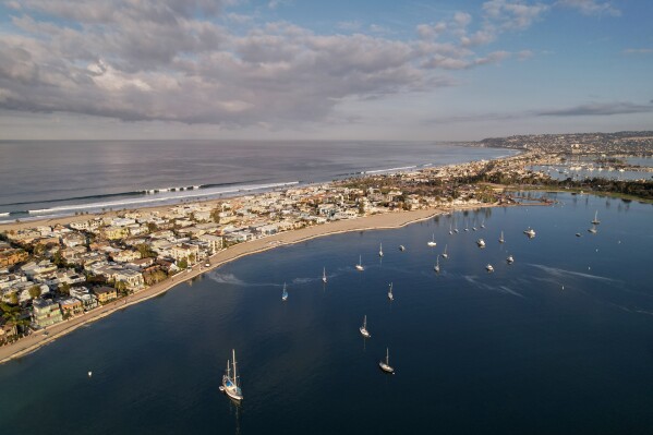 Homes line the shore of San Diego's Mission Bay, Wednesday, Dec. 3, 2025. (AP Photo/Annika Hammerschlag)