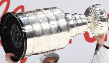 NHL player holding Stanley Cup