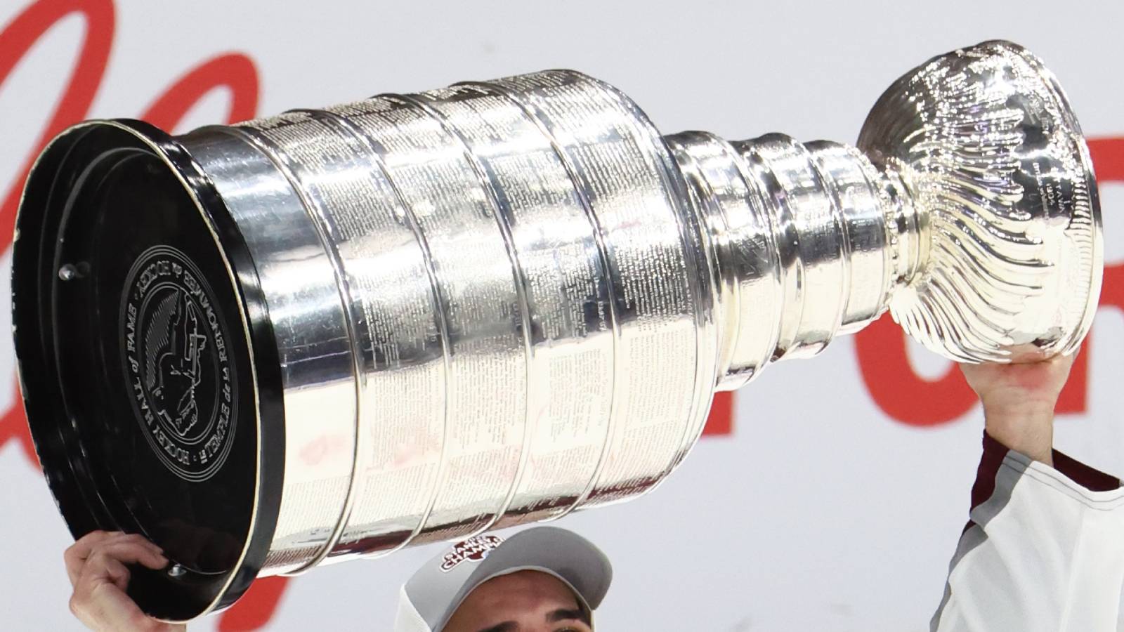 NHL player holding Stanley Cup