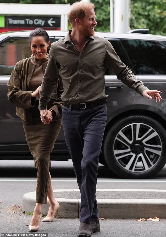 Britain's Prince Harry (R), Duke of Sussex, and his wife Meghan (L), the Duchess of Sussex, arrive at the Australian National Veterans Arts Museum (ANVAM) in Melbourne on April 14, 2026. (Photo by Jonathan Brady / POOL / AFP via Getty Images)