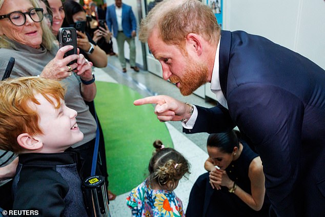 Prince Harry and Meghan, the Duke and Duchess of Sussex, meet with children during their visit to the Royal Children's Hospital in Melbourne, Australia, April 14, 2026. REUTERS/Mark Peterson