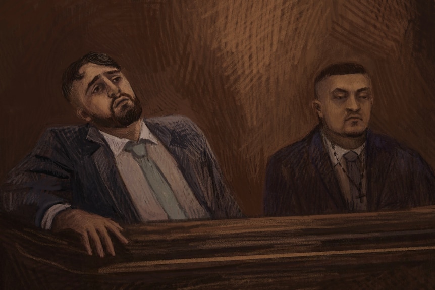 A court sketch showing two dark-haired men in suits sitting the dock.