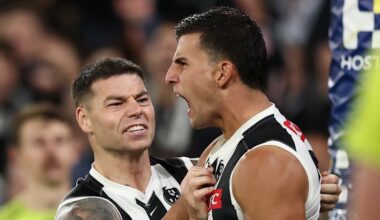 Carlton Blues coach Michael Voss wraps his arms around Elijah Hollands; Collingwood Magpies superstar Nick Daicos shines brightest
