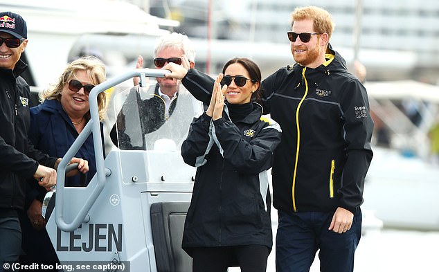 SYDNEY, AUSTRALIA - OCTOBER 21: Meghan, Duchess of Sussex and Prince Harry, Duke of Sussex watch the Elliott 7 Team racing during the Sailing on day two of the Invictus Games Sydney 2018 on Sydney Harbour on October 21, 2018 in Sydney, Australia. (Photo by Mark Kolbe/Getty Images for the Invictus Games Foundation)