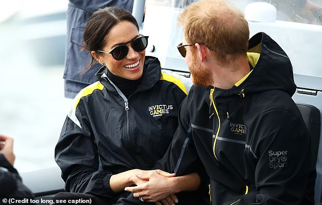 Meghan, Duchess of Sussex and Prince Harry, Duke of Sussex watch on during the Elliott 7 Team racing during the Sailing on day two of the Invictus Games Sydney 2018 on Sydney Harbour on October 21, 2018 in Sydney, Australia. (Photo by Mark Kolbe/Getty Images for the Invictus Games Foundation)