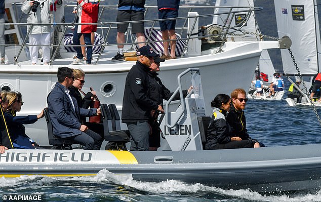 Britain's Prince Harry, the Duke of Sussex and his wife Meghan, the Duchess of Sussex sail on Sydney Harbour on the first day of the Invictus Games in Sydney, Australia, Sunday, October 21, 2018. The Duke and Duchess of Sussex are on a 3-week tour of Australia, New Zealand, Tonga, and Fiji and are in Sydney to launch the 2018 Invictus Games, an Olympic-style event for disabled and ill service people. (AAP Image/Brendan Esposito) NO ARCHIVING 15740553