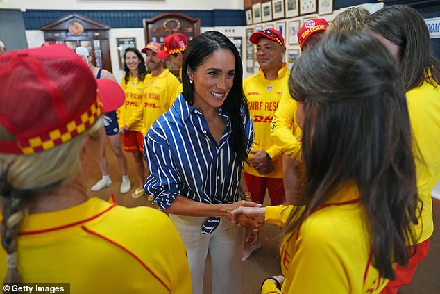 SYDNEY, AUSTRALIA - APRIL 17: Meghan, Duchess of Sussex meets volunteer first responders from Bondi Surf Bathers' Life Saving Club, during a visit to Bondi Beach, on day four of the royal trip to Australia on April 17, 2026 in Sydney, Australia. Volunteers from the organisation, founded in 1907, played an integral role in protecting beachgoers and saving lives during the terrorist attack at Bondi Beach on December 14. (Photo by Jonathan Brady-Pool/Getty Images)