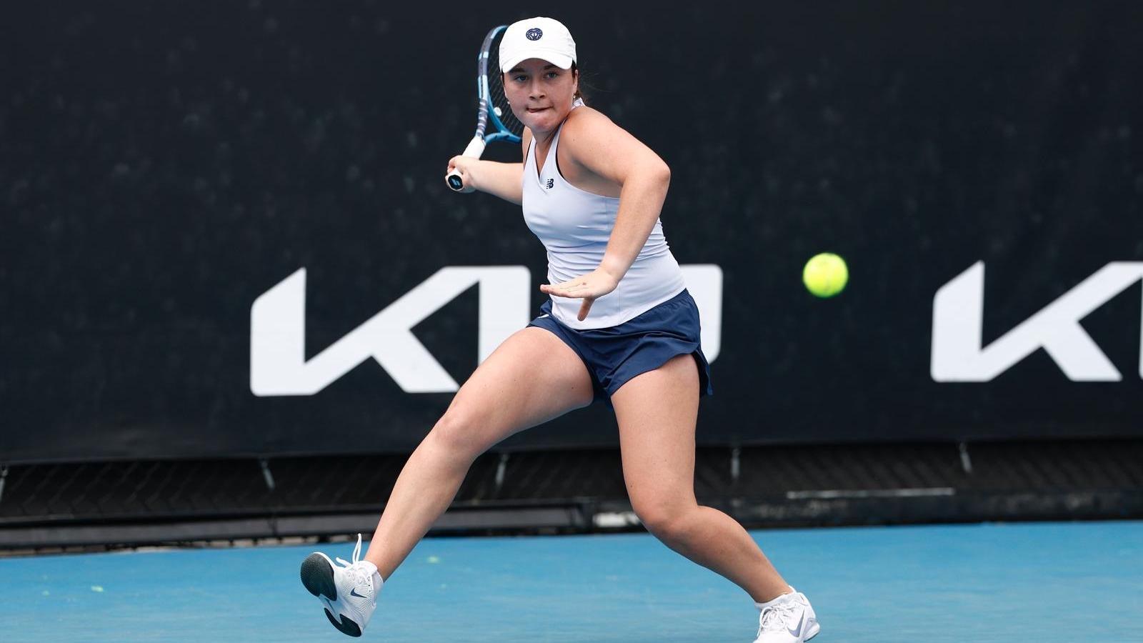Havana Kadi throwing the ball up to serve.