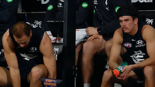Elijah Hollands (right) on the bench in the last quarter.