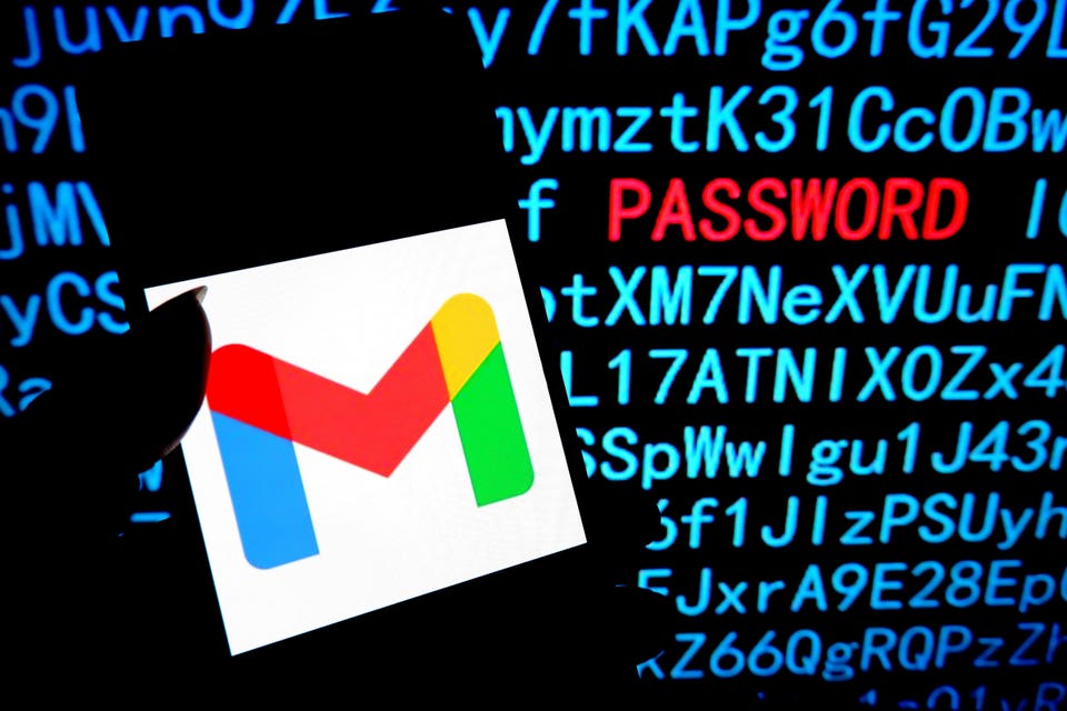 Gmail logon on smartphone, with computer code and 'password' in red behind.
