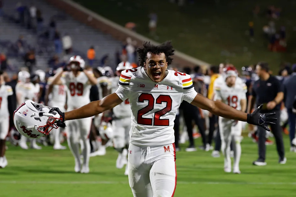 Maryland Terrapins defensive back Jalen Huskey celebrates while running off the field after the game against the Virginia Cavaliers at Scott Stadium.