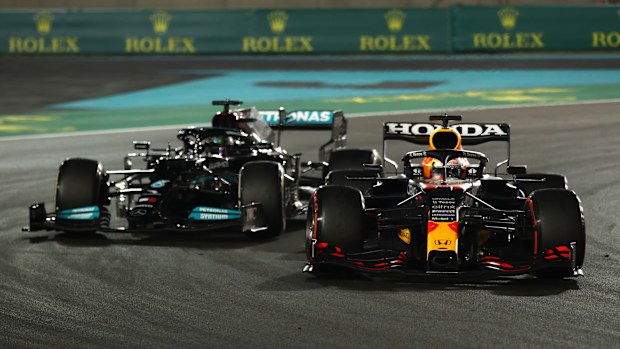 Max Verstappen of the Netherlands driving the (33) Red Bull Racing RB16B Honda leads Lewis Hamilton of Great Britain driving the (44) Mercedes AMG Petronas F1 Team Mercedes W12 during the F1 Grand Prix of Abu Dhabi at Yas Marina Circuit on December 12, 2021 in Abu Dhabi, United Arab Emirates. (Photo by Joe Portlock - Formula 1/Formula 1 via Getty Images)