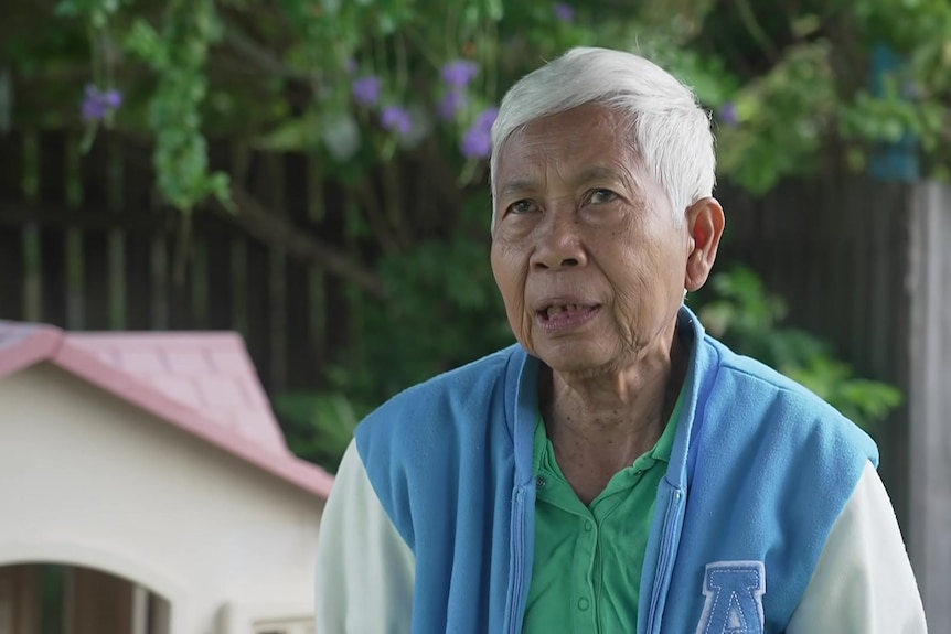 Elderly lady with short grey hair 