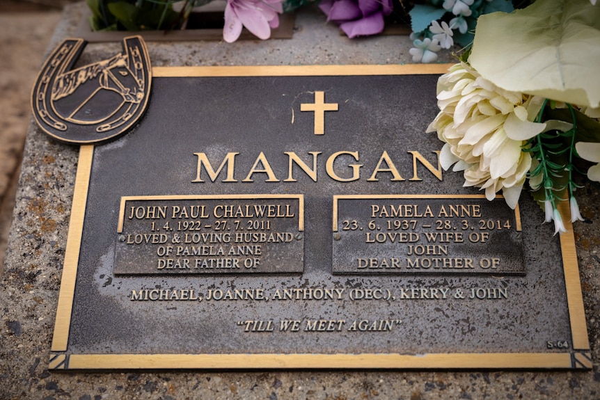 A small grave stone for John Paul and Pamela Anne Mangan. With the names of their children on it.