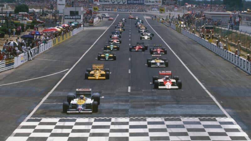 The start of the 1987 French Grand Prix at Paul Ricard with Nigel Mansell (Wiliams-Honda) and Alain Prost (McLaren TAG-Porsche) on the front row.