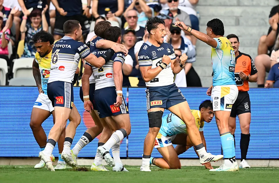 Pictured centre, off-contract Cowboys winger Murray Taulagi.