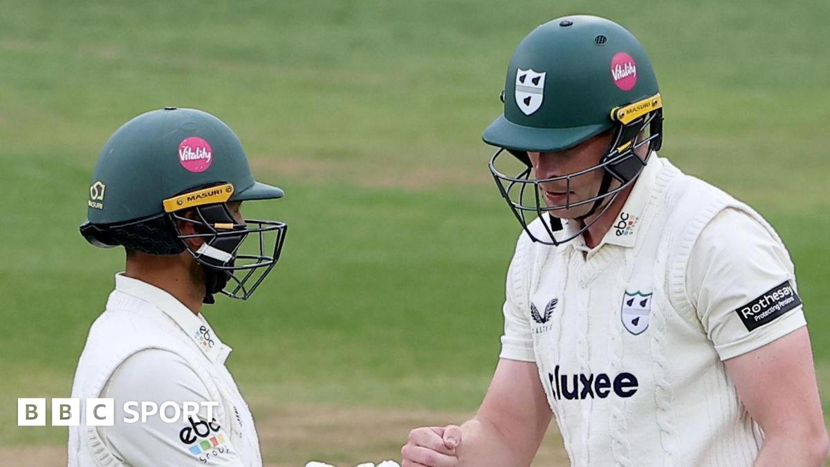 Matthew Waite punches fists with Brett D'Oliveira while batting for Worcestershire