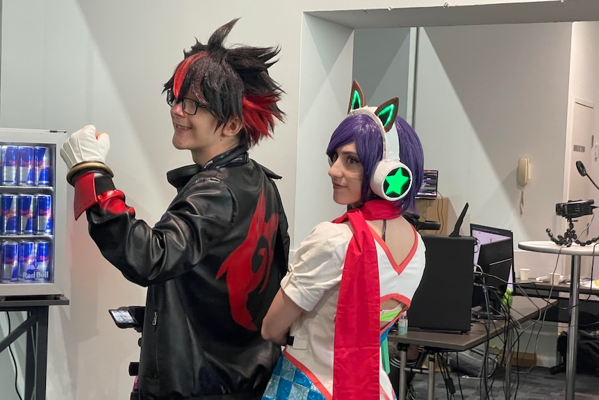 A male and female cosplayer