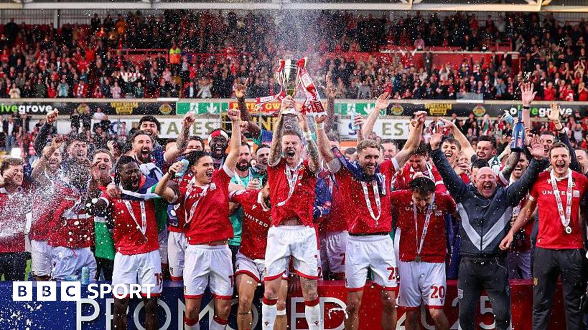 Wrexham's players celebrate promotion to the Championship in 2025