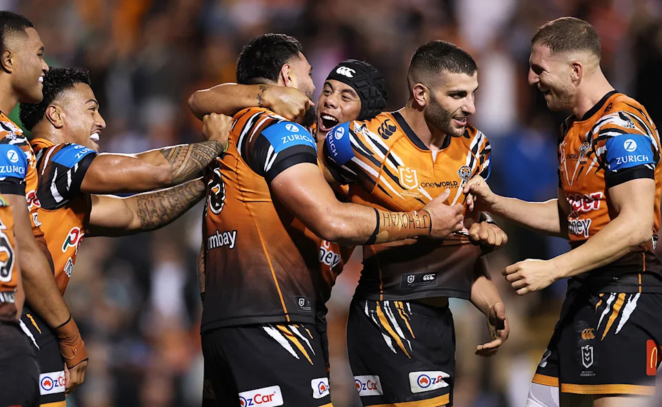 Jarome Luai with Wests Tigers teammates.