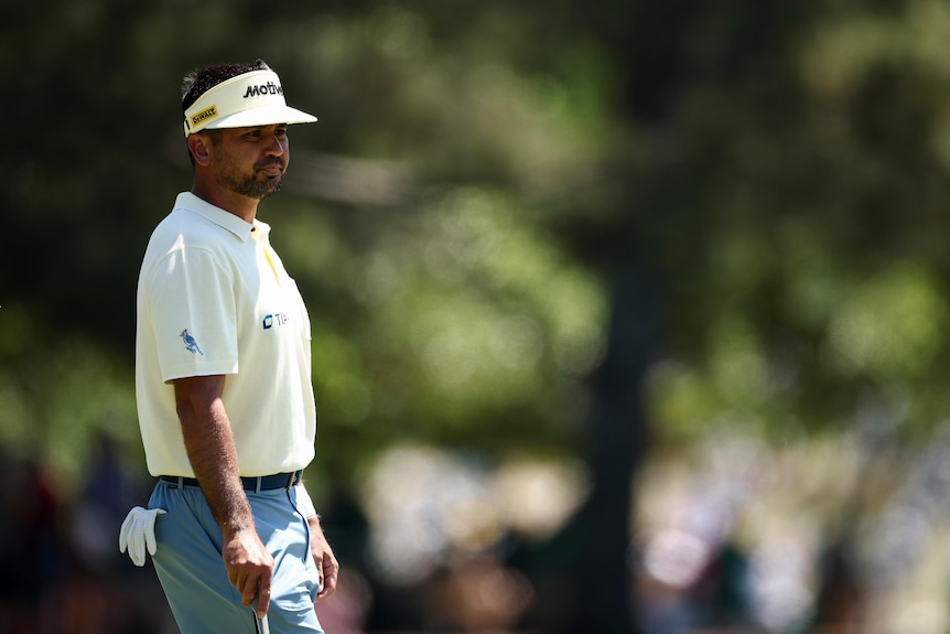 Jason Day wears a visor as he stands during the second round of the Masters at Augusta National.