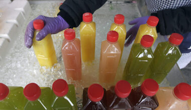 Bottled juice are arranged at a fruit stall in a traditional market in Taipei