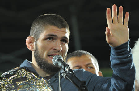 FILE PHOTO: Russia's Khabib Nurmagomedov, UFC lightweight champion who defeated Conor McGregor of Ireland in the main event of UFC 229, speaks during the ceremony of honouring him at Anzhi Arena in Kaspiysk, a city in the republic of Dagestan, Russia October 8, 2018. REUTERS/Said Tsarnayev