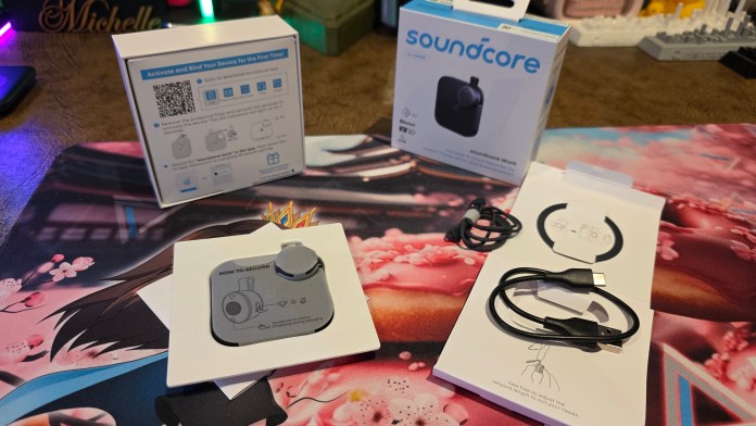 Out of the box showing device, twine, charing cable, and magnetic ring.