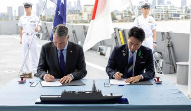 Australian and Japanese officials signing DoI on Upgraded Mogami for Australia